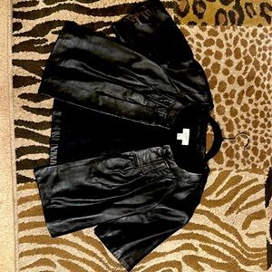 Ann Taylor Loft genuine black, short sleeve leather jacket.